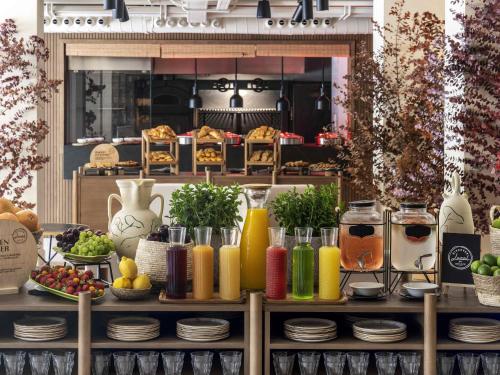 a table topped with different types of juice at Mercure Benidorm in Benidorm