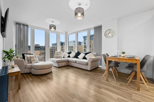 a living room with a couch and a table at The Urban Haven in Birmingham