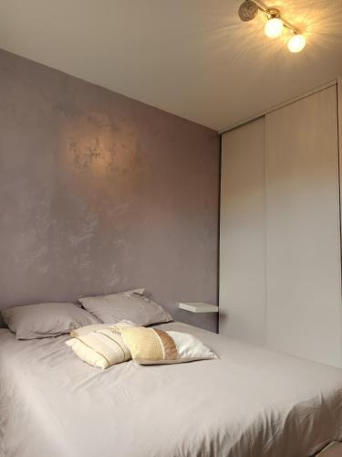 Postel nebo postele na pokoji v ubytování Le Cocon Serenité