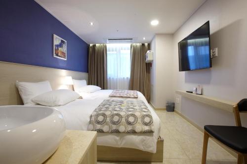 Ένα ή περισσότερα κρεβάτια σε δωμάτιο στο Hotel Sopra Incheon Cheongna