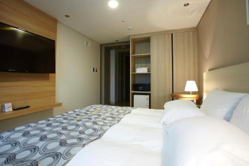 Ένα ή περισσότερα κρεβάτια σε δωμάτιο στο Hotel Sopra Incheon Cheongna