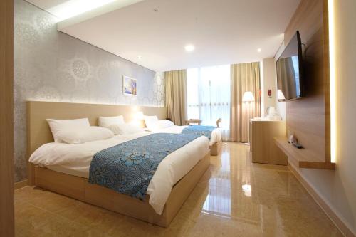 Ένα ή περισσότερα κρεβάτια σε δωμάτιο στο Hotel Sopra Incheon Cheongna