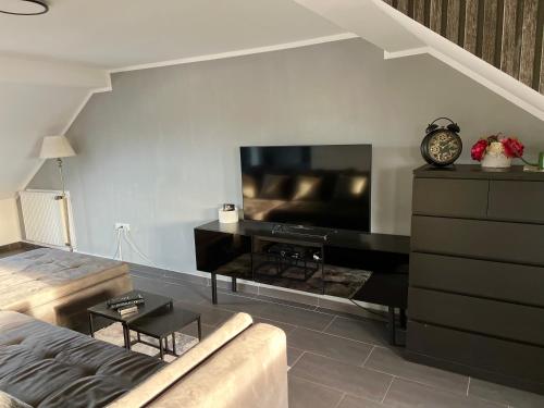a living room with a large flat screen tv at Apartment in Erftstadt , Phantasialand Brühl bei Cologne, Zentral, Bahnhof nah in Erftstadt