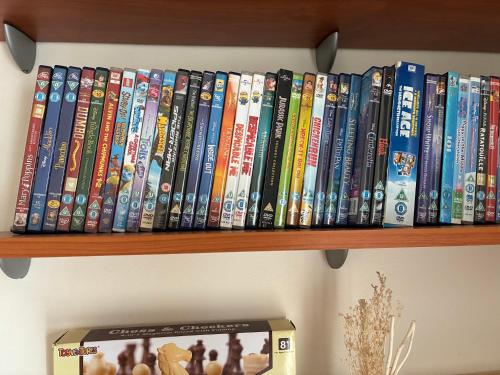 a bunch of books sitting on a shelf at Venus205 in Paphos City