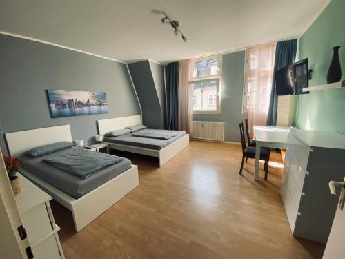 Postel nebo postele na pokoji v ubytování Gemütliche Zimmer - Messe Gruga