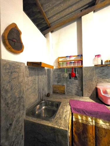 a kitchen with a sink and a counter top at Sea Bay in Kamburugamuwa