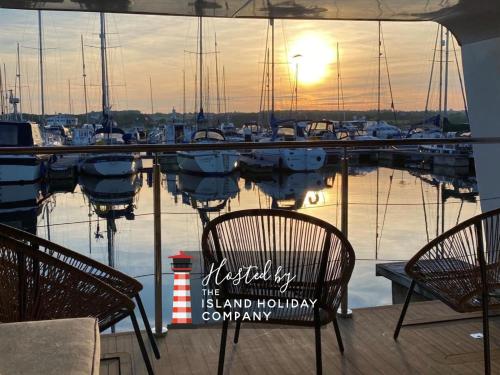 a view of a marina with boats in the water at Island Harbour Houseboat in Newport