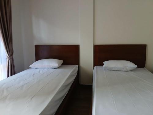 Кровать или кровати в номере Pandava House Lombok