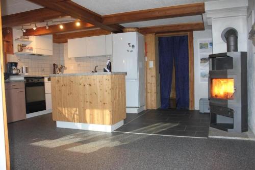a kitchen with a stove in the middle of it at Fäsch in Flumserberg