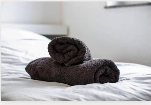 Postel nebo postele na pokoji v ubytování StayBaran City Apartment Bochum