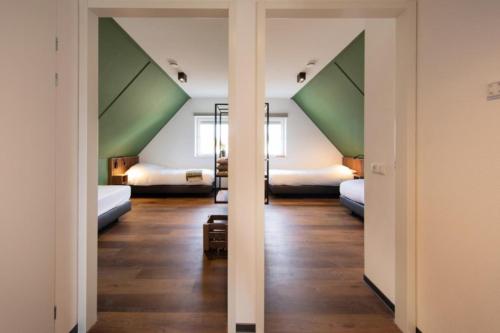 Voodi või voodid majutusasutuse Premium Game Villas, Parc Maasresidence Thorn toas