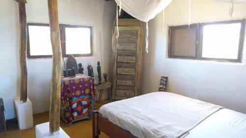 Postel nebo postele na pokoji v ubytování Cabaceira Village