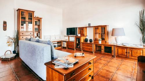a living room with a couch and a table at Amadora Terrace View By Gt House in Amadora