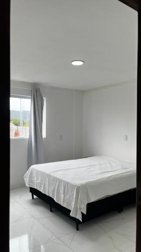 En eller flere senge i et værelse på Hospedagem Areias do Mariscal