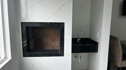 Køkken eller tekøkken på Hospedagem Areias do Mariscal