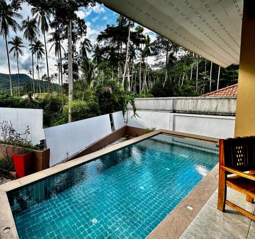 a swimming pool on the roof of a house at 3 bedroom villa with swimming pool Lamai in Nathon Bay
