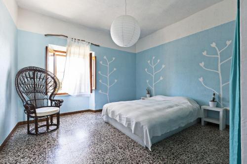 Postel nebo postele na pokoji v ubytování Ferienhaus Stazzo Mit Garten In Luogosanto