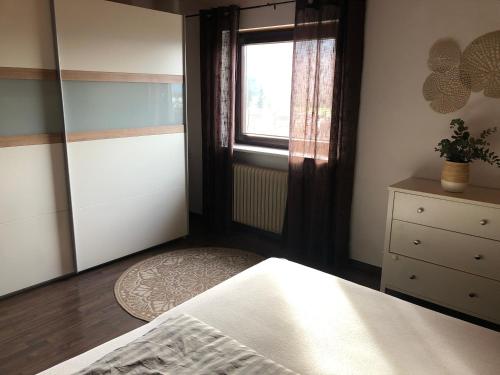 Postel nebo postele na pokoji v ubytování Mühlebach Apartment