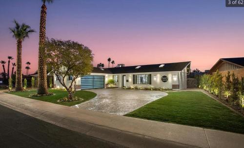 a house with a palm tree and a driveway at Private Scottsdale Oasis in Scottsdale