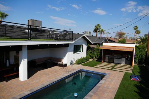 a house with a swimming pool in the yard at Private Scottsdale Oasis in Scottsdale
