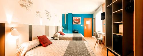 Postel nebo postele na pokoji v ubytování Hotel Olympus