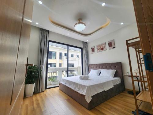 Postel nebo postele na pokoji v ubytování Timi Homestay Near the Wave Park Ocean Park 2