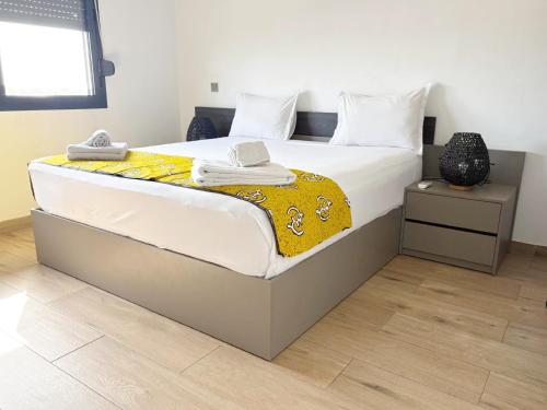 Voodi või voodid majutusasutuse DakarByDays-DBD007-Appartement AMELIE 3 chambres toas