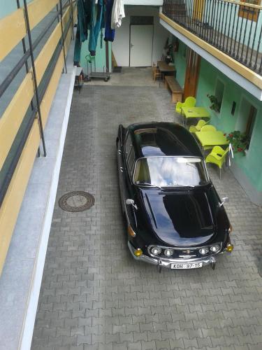 a black car parked inside of a building at Penzion Netolice in Netolice