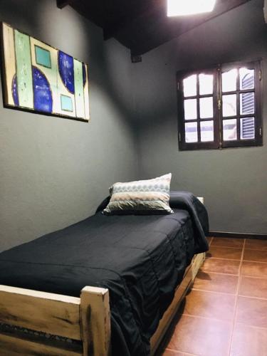 Ένα ή περισσότερα κρεβάτια σε δωμάτιο στο Casa Calamuchita