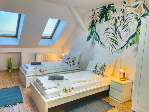 Ένα ή περισσότερα κρεβάτια σε δωμάτιο στο Magenta Apartman