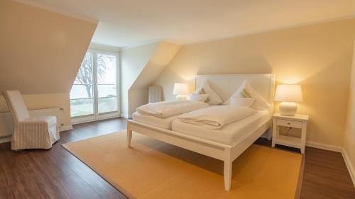 Postel nebo postele na pokoji v ubytování Seehof