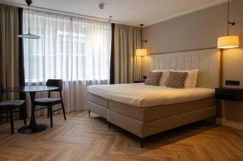 Postel nebo postele na pokoji v ubytování By Friso Den Haag - Scheveningen