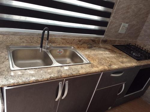 Kuchyň nebo kuchyňský kout v ubytování Ike Service Apartments