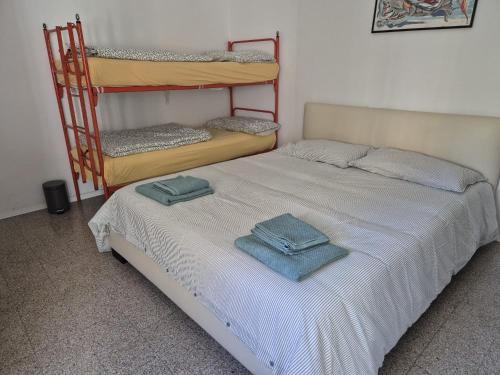 En eller flere senge i et værelse på Villetta Marina