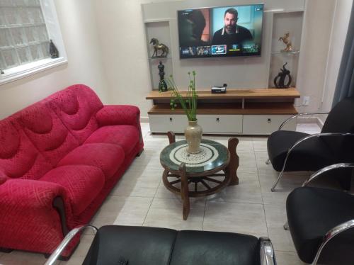 TV a/nebo společenská místnost v ubytování Casa Alto Padrão px ao Centro