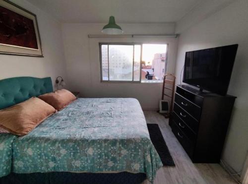 Ένα ή περισσότερα κρεβάτια σε δωμάτιο στο Departamento 4 norte 170 viña