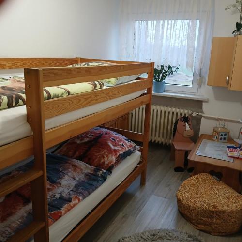 a room with two bunk beds and a window at Maja in Guhrow