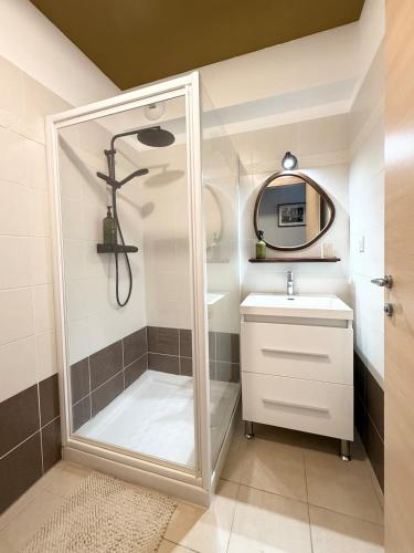 a bathroom with a shower and a sink at Beautiful 2 bedroom apartment with pool in Saint Florent in Oletta
