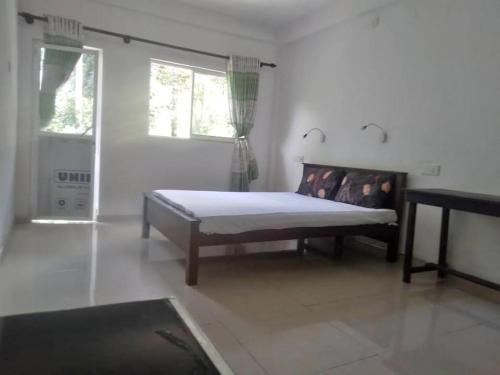 Ένα ή περισσότερα κρεβάτια σε δωμάτιο στο Kandy Crush Nature Villa