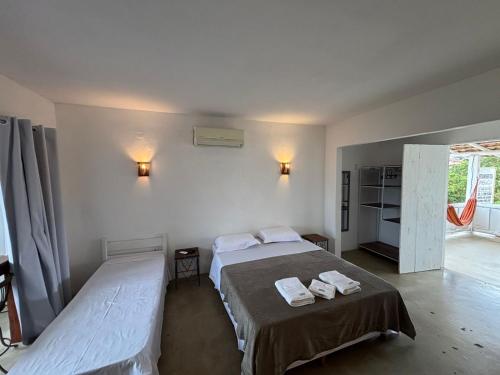 Ένα ή περισσότερα κρεβάτια σε δωμάτιο στο Apartamentos Cambucá