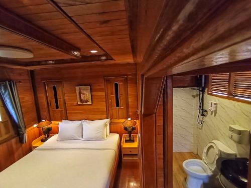 Postel nebo postele na pokoji v ubytování Song Lay Resort, Koh Mook, Trang THAILAND