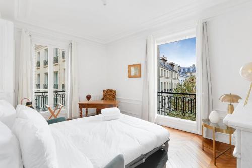 Ένα ή περισσότερα κρεβάτια σε δωμάτιο στο Le Marais élégant