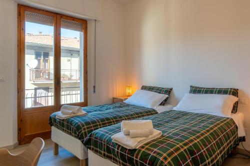 Postel nebo postele na pokoji v ubytování Dimore di Sant'Albino Montepulciano