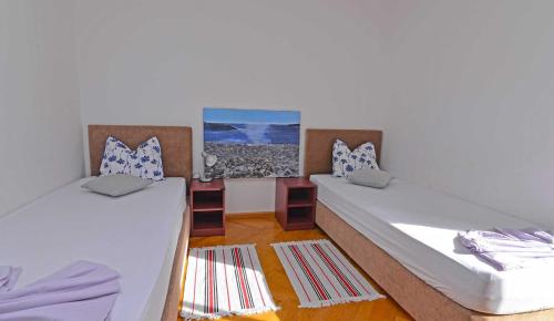 Postel nebo postele na pokoji v ubytování Villa Kaciol Veli Lošinj