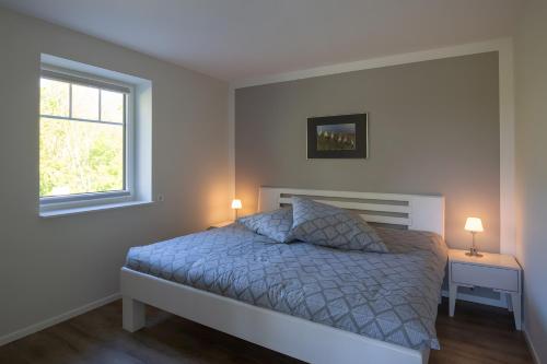 Ένα ή περισσότερα κρεβάτια σε δωμάτιο στο Ferienhaus Koch