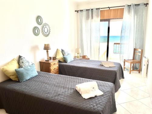 Postel nebo postele na pokoji v ubytování Atlântico View - Beach front - Quarteira