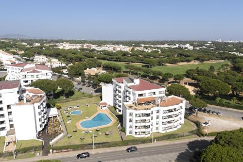 an aerial view of an apartment complex with a swimming pool at Dona Marieta House in Vilamoura