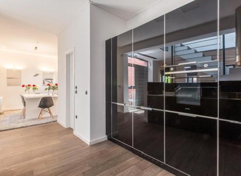 a room with a glass partition with a table in it at Pink Mango Hostel in Athens