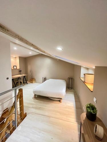 Postel nebo postele na pokoji v ubytování Le cosy duplex de l'Isle d'Espagnac