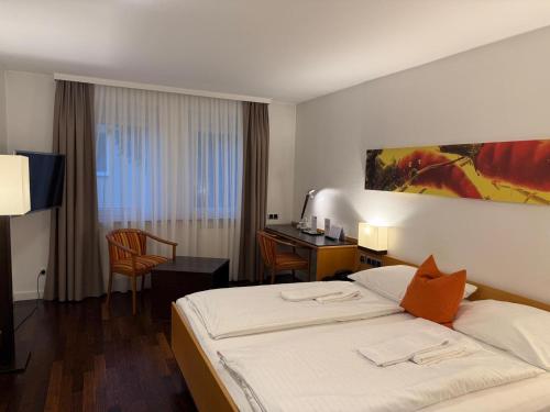 Postel nebo postele na pokoji v ubytování Hotel Germania